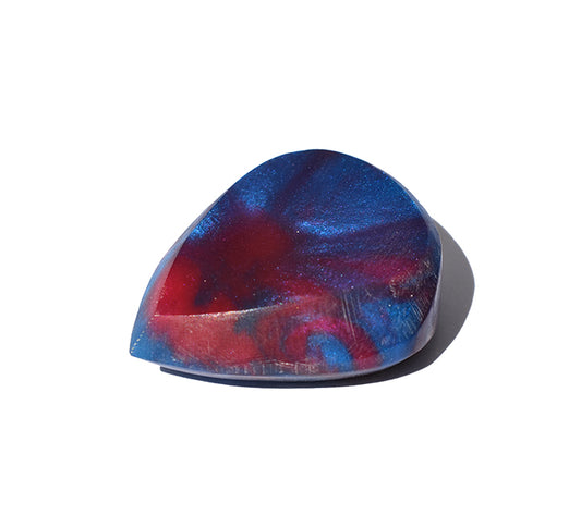 Right side angle of blue and red swirl resin guitar pick with bevel edge