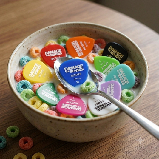 A bowl of cereal that has multi coloured guitar picks in it.