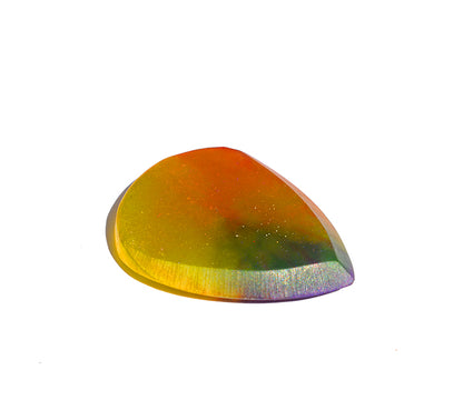 Left side angle of orange and purple resin guitar pick with cream bevel edge