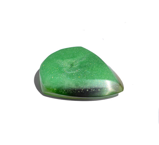 A polished green resin guitar pick with black and mica glitter throughout
