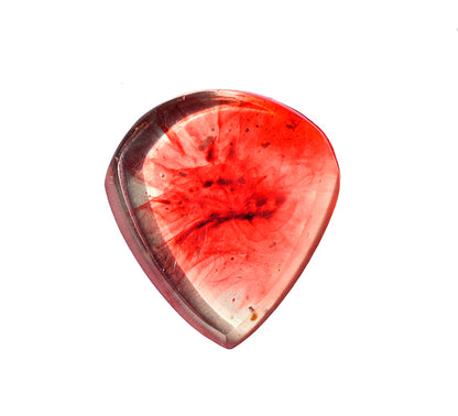 The front of a translucent red resin guitar pick  with natural blood looking pattern in clear
