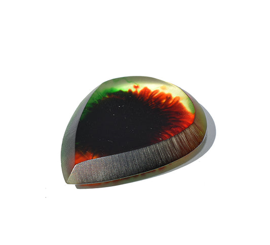 Right side angle of black resin guitar pick with red and orange fiery swirl and bevel edge