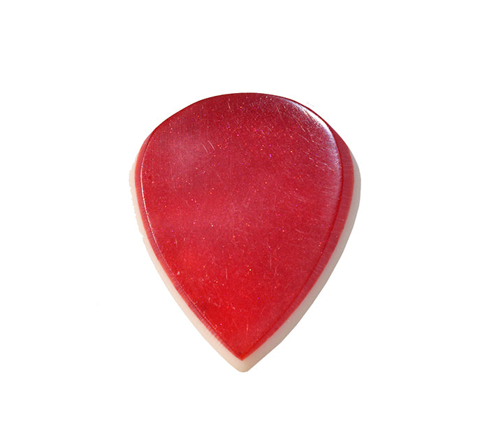 Front side of a red resin guitar pick with contoured bevel edge on white background
