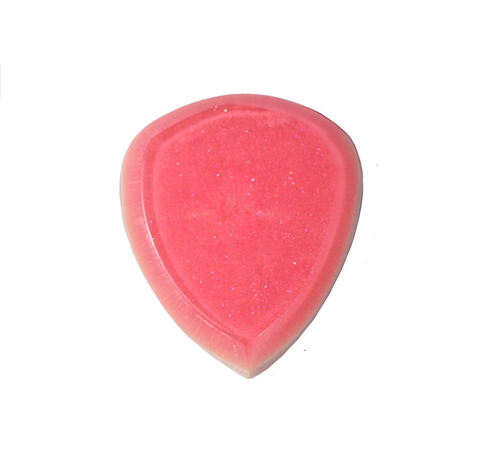 Back view of pinkish red resin guitar pick showing smooth surface